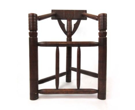A 19th century oak turners chair, the chip carved top rail and bobbin turned arms over turned legs and stretchers, h. 84 cm, 
