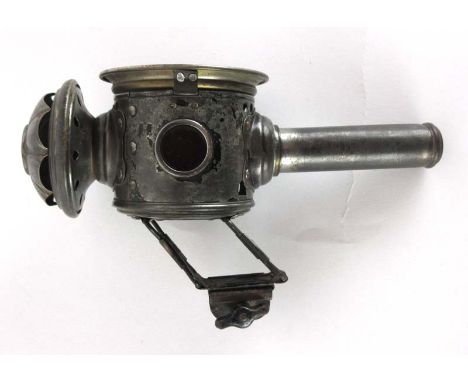 An early 20th century Edelko Luxor bike lamp possibly from a penny farthing, with a candle compartment, having three circular