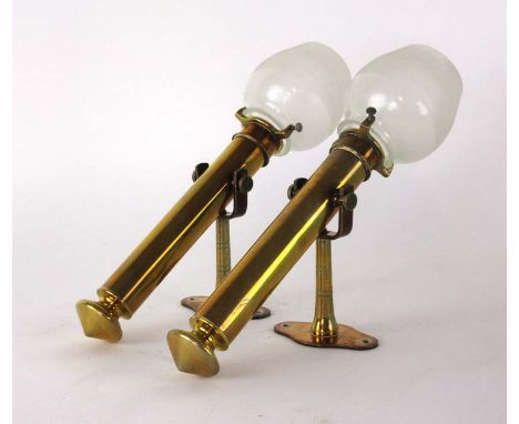 A pair of late 19th century brass ship's lamp, with frosted glass shades and the matching wall brackets, h. 32 cm CONDITION R