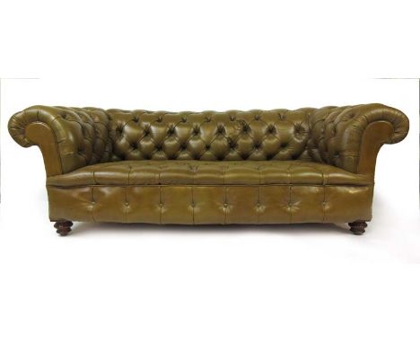 A Edwardian walnut Chesterfield sofa upholstered in olive green leather, h. 64 cm, w. 184 cm, d. 85 cm CONDITION REPORT: Cast