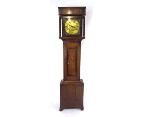 An early 19th century oak and mahogany crossbanded longcase clock, the engraved brass face with Roman and Arabic numerials, p