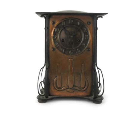 A 1930's Liberty's style embossed copper mantle clock by John Kendrick of Birmingham, h. 35 cm, w. 25 cm, d. 15 cm CONDITION 