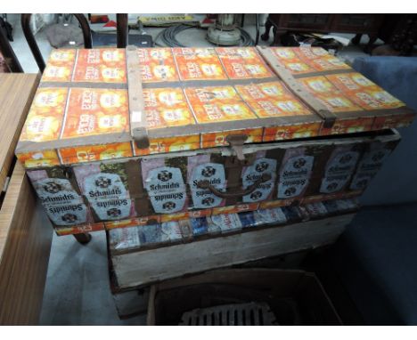 Three vintage tin trunk, decorated with drinks labels