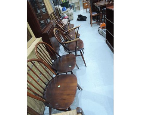 A set of six (four plus two) Ercol hoop and stick back chairs, dark stain