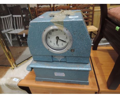 A vintage time recorder clock