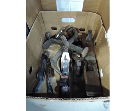 A selection of woodworking tools including planes