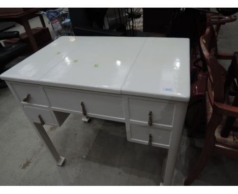 A vintage painted lift top dressing table