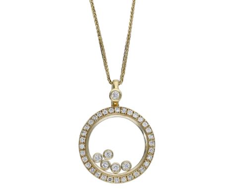 A diamond pendant on chain, the circular pendant with glazed compartment revealing five floating brilliant-cut diamond collet