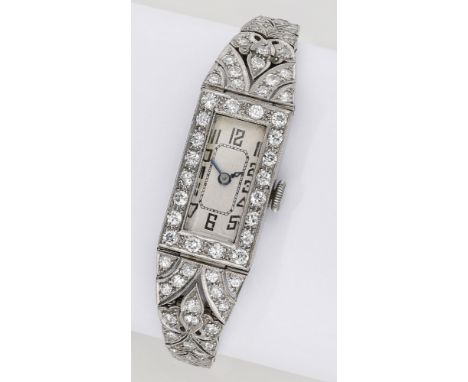 Swiss. A lady’s platinum and diamond-set Art Deco cocktail watch, circa 1930. Movement: manual winding. Dial: associated silv