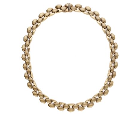 A 9ct gold choker necklace by Cropp & Farr, 1973, composed of hollow arabesque-shaped links with Florentine crosshatch finish