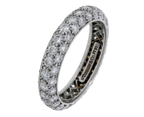 A diamond eternity ring by Tiffany & Co., pavé-set throughout with brilliant-cut diamonds, stamped ‘© TIFFANY & CO. PT 950’, 
