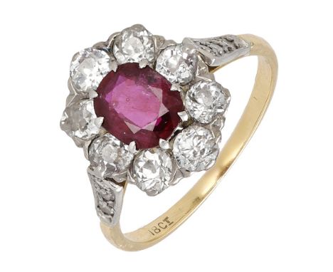 A ruby and diamond cluster ring, the oval-cut ruby claw set within a surround of old-cut diamonds, between diamond set should