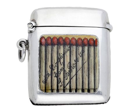 A George V silver and enamel vesta case, the front with an enamelled panel depicting a row of matches, with the superimposed 