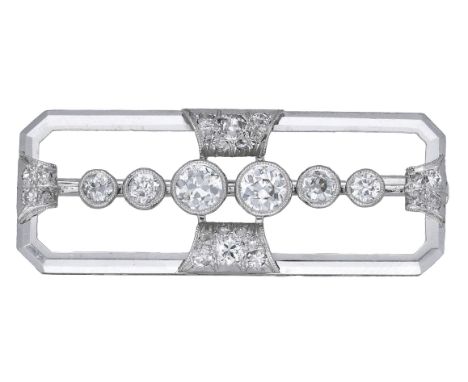An Art Deco diamond panel brooch, the open panel centred with a row of graduated old brilliant-cut diamonds in millegrain col