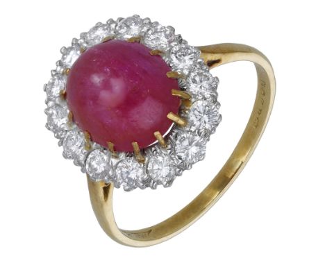 An 18ct gold ruby and diamond cluster ring, 1975, the ruby cabochon set within a surround of brilliant-cut diamonds, maker’s 