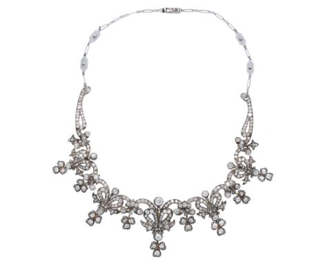 A diamond necklace, circa 1890, the articulated frontispiece designed as a garland with ribbon bow motifs, set throughout wit