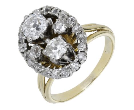 A diamond dress ring, the old brilliant and cushion-shaped diamonds in an open surround within a similarly-set border, betwee