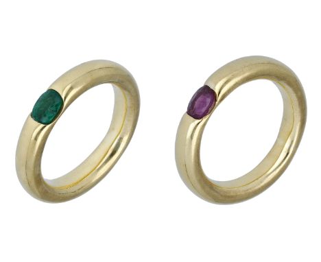 An emerald ring and matching ruby ring, both with polished bands tension-set with an oval-cut emerald or ruby, stamped ‘750’,