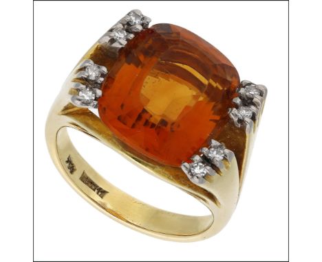 A citrine and diamond dress ring, the cushion-shaped citrine between bifurcated raised shoulders, each set with pairs of sing