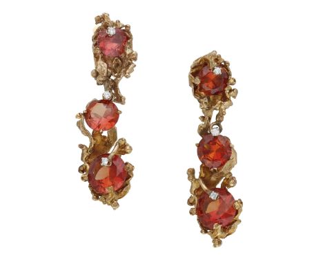 A pair of gem-set earrings, circa 1970, the drops designed as a graduated series of circular-cut orange garnets, each envelop