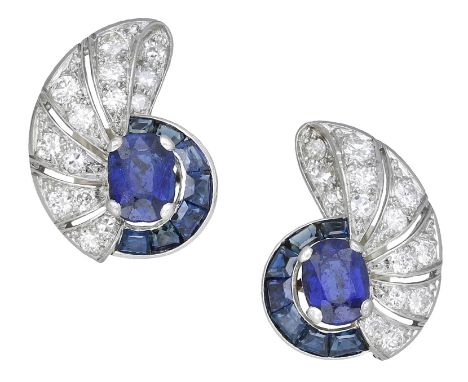 A pair of mid 20th century sapphire and diamond earrings, the vari-cut sapphire clusters to a pierced tapered surround of bri