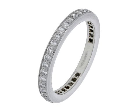 A platinum and diamond eternity ring by Tiffany & Co., millegrain-set throughout with brilliant-cut diamonds, London hallmark