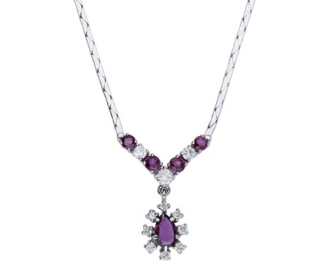 A ruby and diamond necklace, the fancy-link chain leading to a circular-cut ruby and brilliant-cut diamond frontispiece, susp