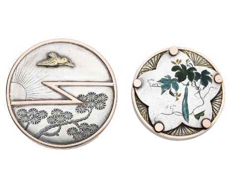 Two Aesthetic Movement brooches, the first decorated with a bird in flight above flowering blossom branches, the second with 