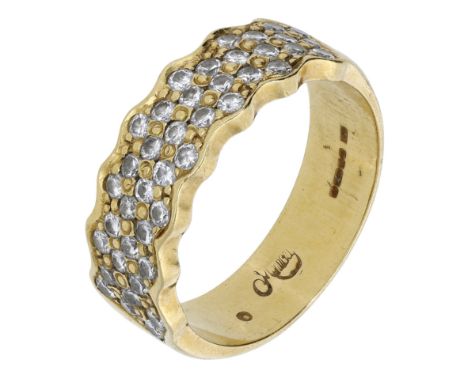 An 18ct gold diamond-set band ring, 1990, pavé-set to the front with brilliant-cut diamonds within an undulating outline, Lon