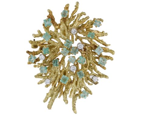 An emerald and diamond brooch, circa 1970, of textured abstract design, set throughout with brilliant-cut diamonds and step-c