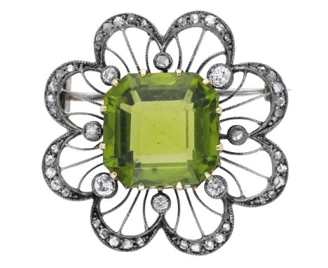 A late 19th century peridot and diamond brooch, the pierced brooch of scalloped outline and millegrain lattice design, centre