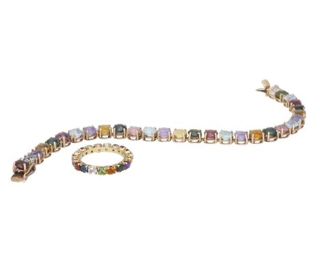 A vari gem-set bracelet and eternity ring, both set with assorted gemstones including amethyst, citrine, peridot, garnet, aqu