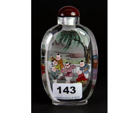 A large Chinese inside painted lead crystal snuff bottle of children playing blind mans buff, H. 12.5cm.