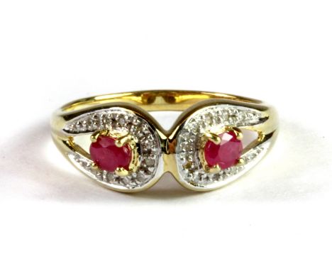 A 9ct yellow gold ruby and diamond set ring, (P.5).