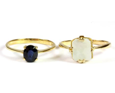 A 14ct yellow gold (stamped 585) sapphire set ring, (K.) and a 9ct yellow gold mother of pearl set ring, (L).