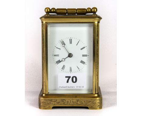 An engraved gilt brass carriage clock, H. 12cm.