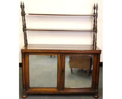 A 19th century mahogany mirrored door cabinet with double back shelf on cross stretcher supports, W. 104cm, H. 142cm.