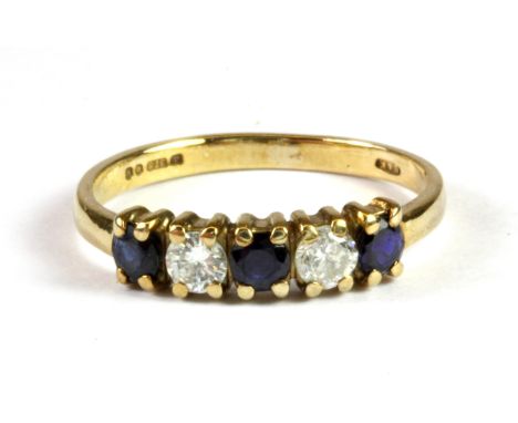 A 9ct yellow gold sapphire and diamond set half eternity ring , (K.5).