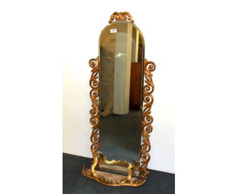 A gilt framed hall mirror and gilt wall shelf, H. 112cm.