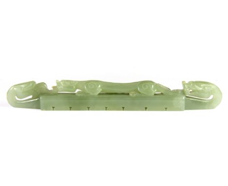 An early to mid 20th century Chinese carved nephrite jade brush rest, W. 18cm.