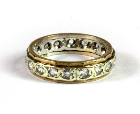 A 9ct yellow and white gold stone set wedding band, (K).