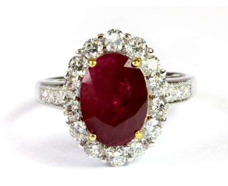 An 18ct white gold ring set with a Burma untreated ruby and brilliant cut diamonds, (approx. 3.13ct ruby and 0.91ct diamonds,