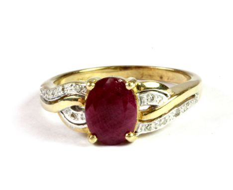 A 9ct yellow gold ruby and diamond set ring, (L).