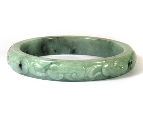 A superb Chinese carved jadeite jade bangle decorated with bats for luck, W. 1.5cm, internal Dia. 7.6cm.