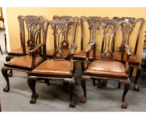 A set of seven Chippendale style carved mahogany dining chairs including two carvers.