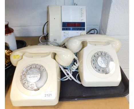 A pair of cream traditional GPO telephones, together with a 70s style Beta Comm telephone answering machine with radio. (1 tr