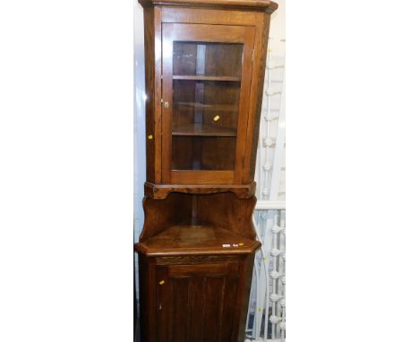 A oak corner cabinet, with glazed high level glazed cabinet, low level storage cabinet, with counter shelf, approx 200cm high