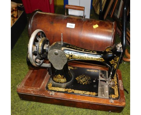 A manual Singer sewing machine, cased.