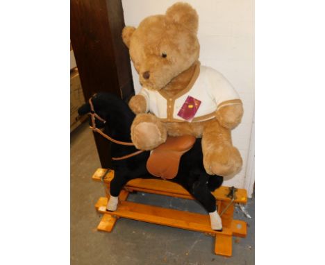 A Thoroughbred Horses rocking horse, together with a large Teddy with His Playful Pals Passport attached.