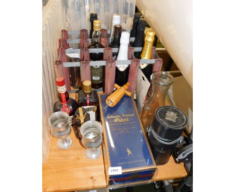 A quantity of liqueurs, brandy and sparlking wines, together with a boxed Johnnie Walker Oldest Scotch whisky, and a Grants o